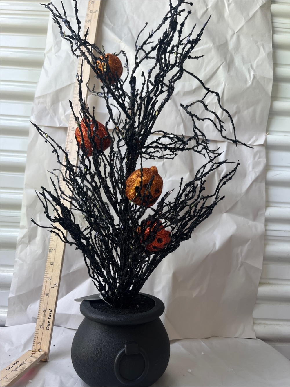 Black Glitter Branch Arrangement with Orange Pumpkin Accents